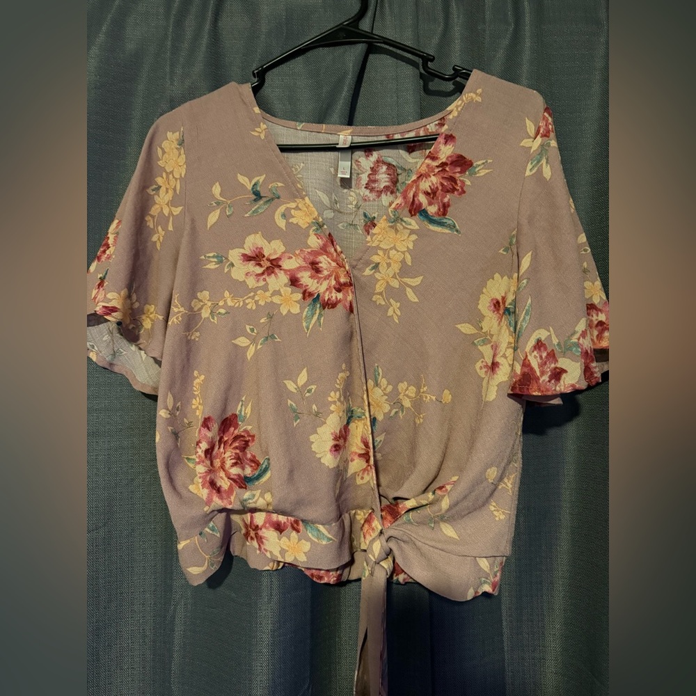 This is a floral wrap top. It is a size large.